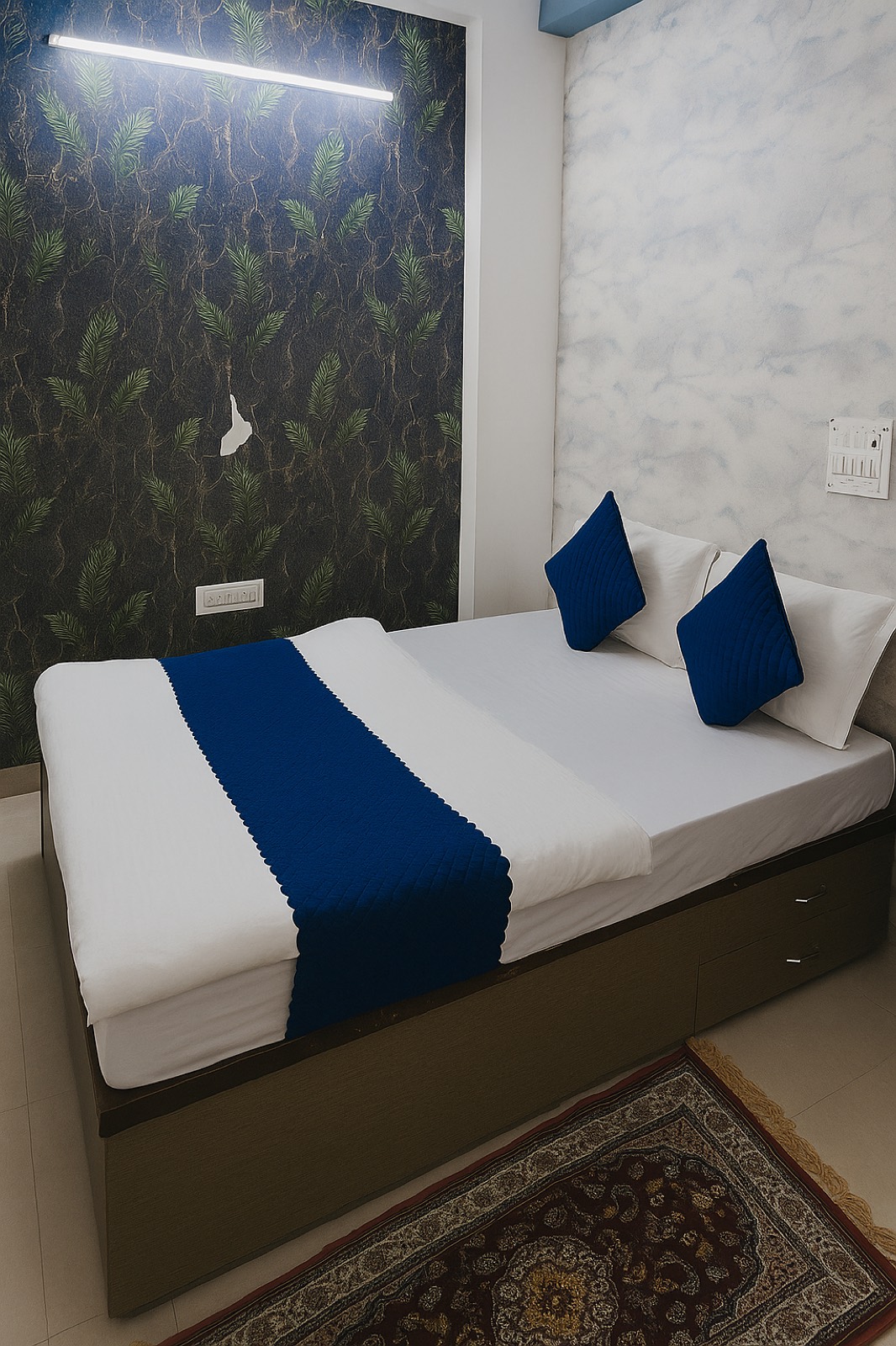 Dev Hotel Mansarovar deluxe room with blue bedding